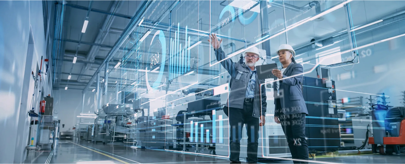 Engineers reviewing asset data on the plant floor